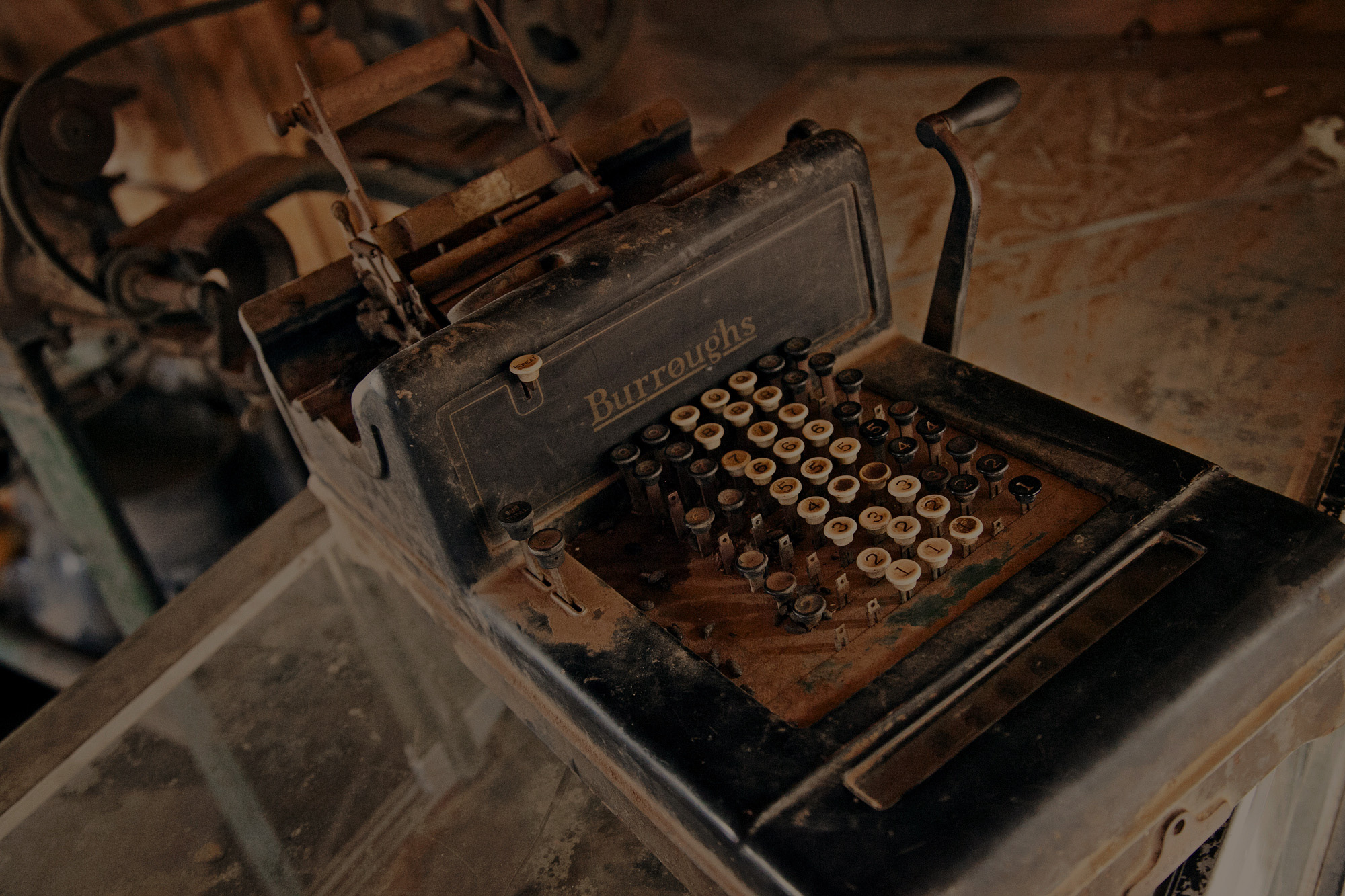 old cash register on an old wooden table